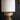 Close-up of solid mango wood lamp base with carved detail.