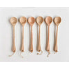 A row of mango wood spoons in the kitchen.