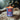Candle in a can labeled 'Syrup d'erable Pur' with a Christmas tree in the background