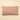 Red and white striped pillow on a beige background