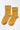 Pair of mustard yellow socks on a white background