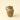 Brown ceramic pitcher on a beige background