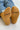 Mustard yellow socks with 'LE BON SHOPPE' text worn with blue jeans on a light background
