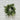 Green wreath on a white brick wall