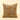 A square decorative throw pillow featuring a woven pattern of elephants over wavy stripes in warm brown and beige, set against a solid cream background.