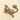 An antique-style brass hanging hook shaped as a tiger, featuring detailed embossed scales and a textured finish, set against a solid cream background.