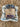Triple Berry Jam with blue gingham kitchen towel, wrapped with a jute twine ready for gifting. 