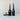 Two green bottles with green tree candles on a white surface.