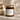 Candle jar labeled 'velvet library' by C&T Candle Co. on a neutral background