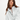 Woman wearing a white pullover on a white background
