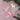 Winged Unicorn Ornament in shades of pink and white, each with golden wings and a long tail. 