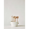 Wooden Spoons in a large ceramic pot.