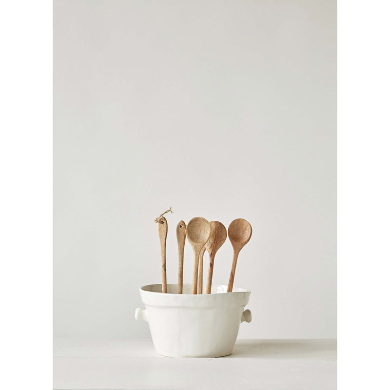 Wooden Spoons in a large ceramic pot.