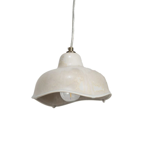 Vintage inspired ceramic pendant lamp with curved edges in cream color. 