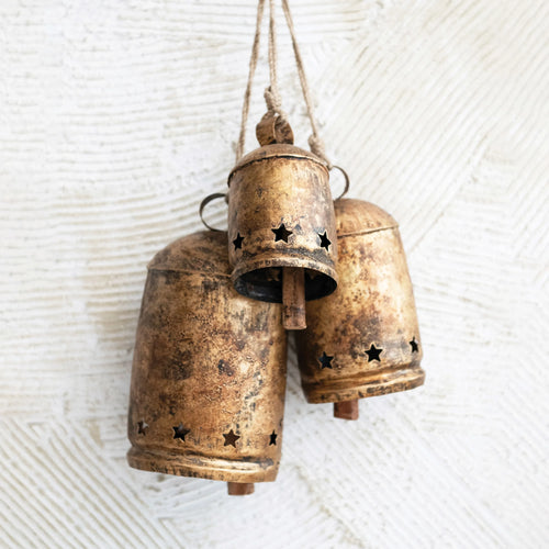 Set of 3 antique bells with heavy distressed finish and jute rope hangers.