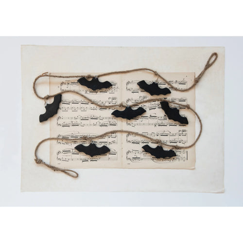 Spooky Bat Garland on music notes.