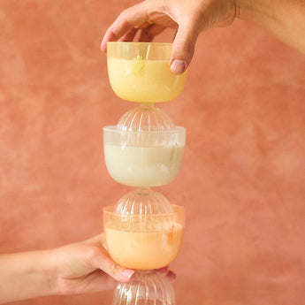 Stacked champagne coupe candles. 