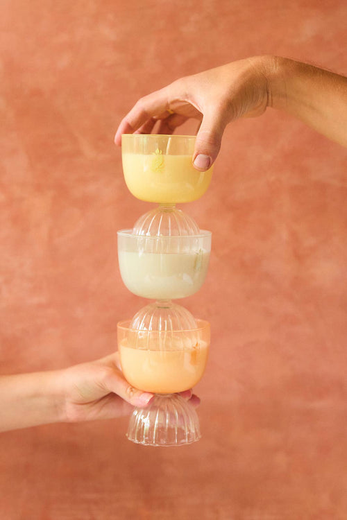 Stacked champagne coupe candles. 