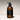 Brown hand wash bottle with pump on a light background