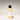 Baby serum bottle with black cap and white label on a gradient background