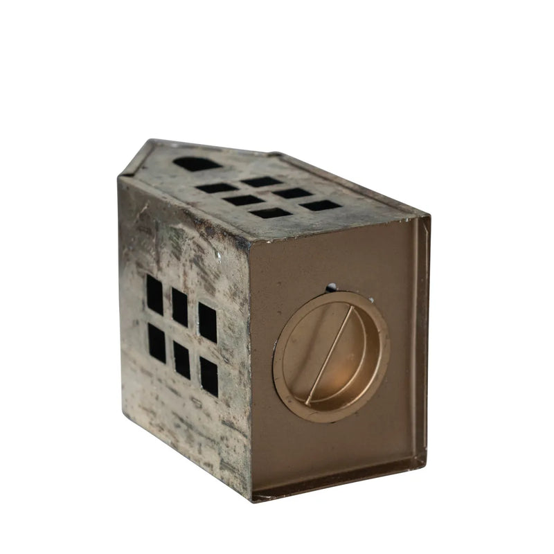 Bottom of the large antique metal house has an opening for you to add a tealight or tiny sisal tree inside. 