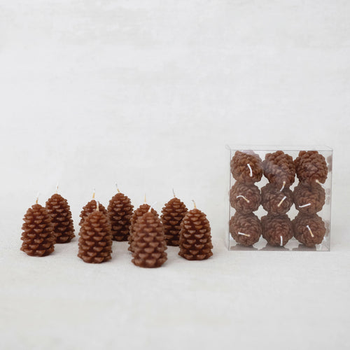 Unique brown pinecone shaped tea lights in a set of nine.