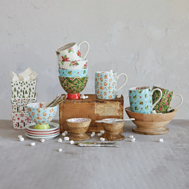 Mango wood and stoneware mugs, bowls and plates with holiday icons.