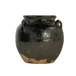 Terracotta and black vase pot. 