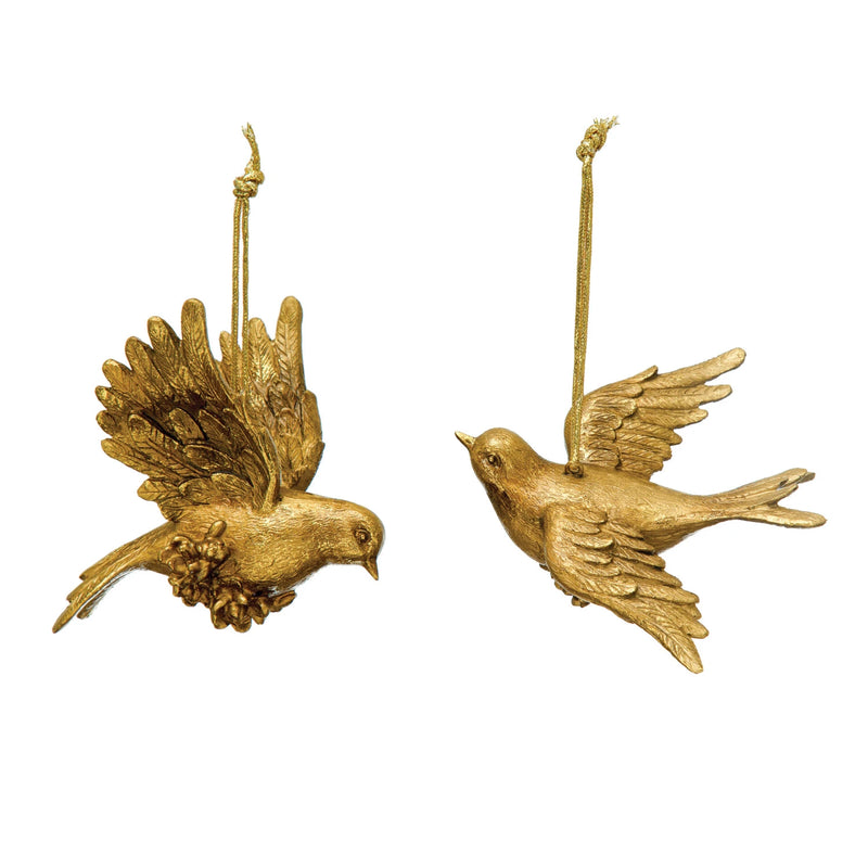 Two styles of resin dove ornaments with a gold finish