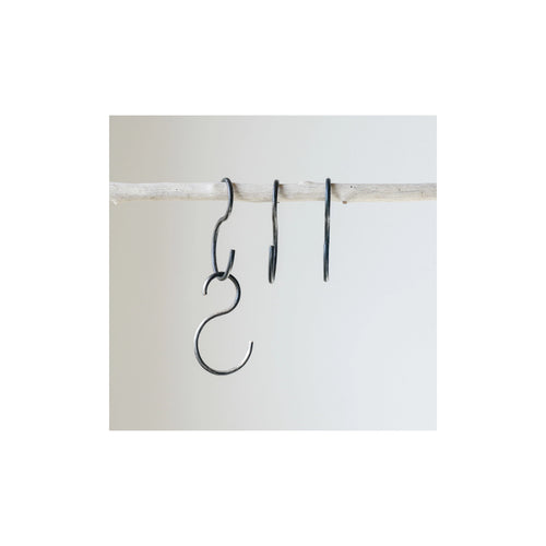 S-Hooks hanging from a wooden stick, displaying how easy it is to hang the S-Hooks.