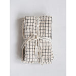 Folded grid cotton tea towel with a creative coop ribbon.