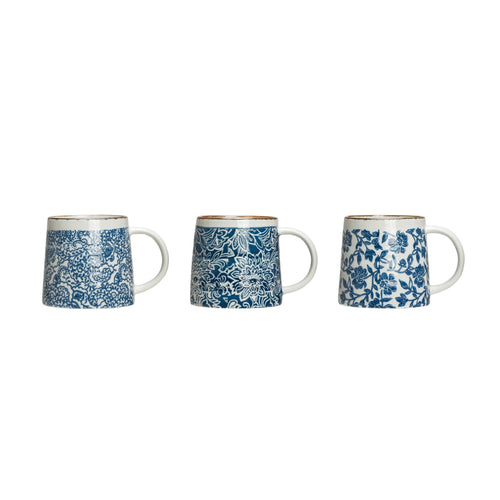 Three different styles of hand-stamped blue/white stoneware mug.