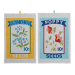 Two cotton tea towels with forget me not and poppy seed packages printed on them.