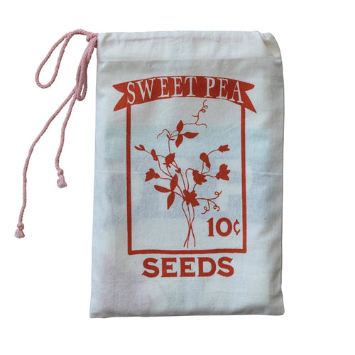 Cotton Drawstring bag containing two cotton printed tea towels. 