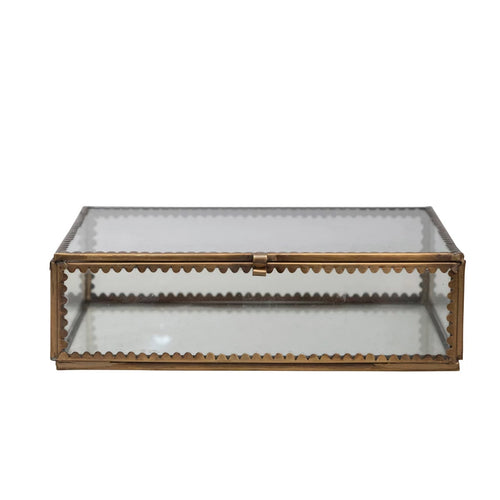 Brass and glass display box with scalloped edges.