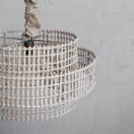 Natural colored cotton chambray chandellier chain cover displayed with a beautiful hand woven chandellier