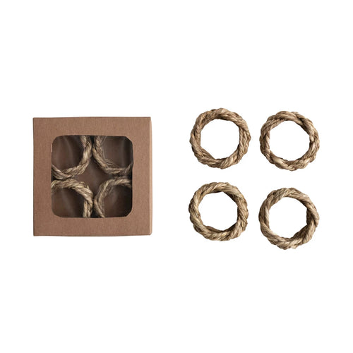Boxed set of four round braided seagrass napkin rings. 