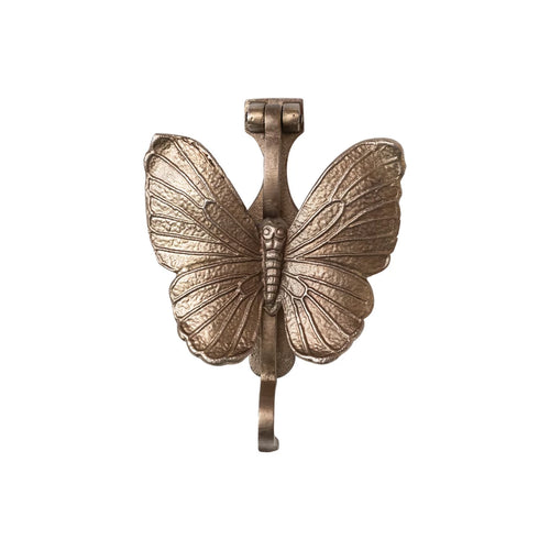 Gold colored cast iron butterfly door knocker