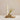 Stoneware vases and candle holder set on a tray, styled with a taper candle, dried grass, and wooden matches for a warm, rustic display.
