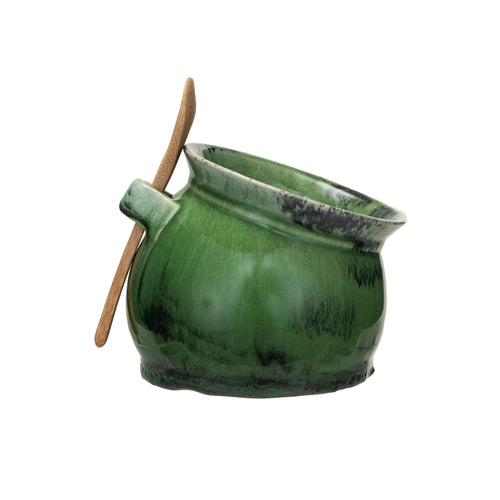 Stoneware salt dish with an acacia wood spoon, in a reactive green glaze finish.