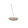 Stoneware incense holder with embossed heart styled with a stick of incense.