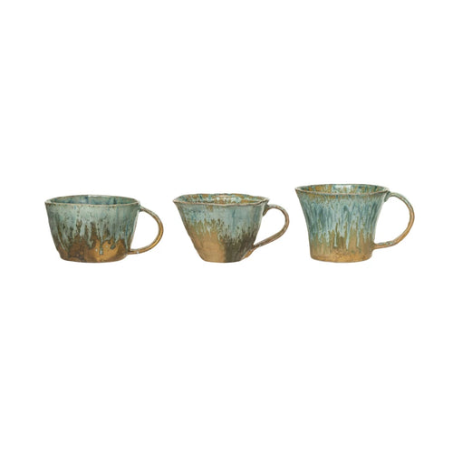 Glazed stonware mugs in various shapes.