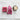 Two pink cotton terry washcloths with scalloped edges and embroidered text, one reading "Hello Gorgeous" and the other "Hello Beautiful," displayed on a white surface alongside a ceramic dish holding a bar of soap.