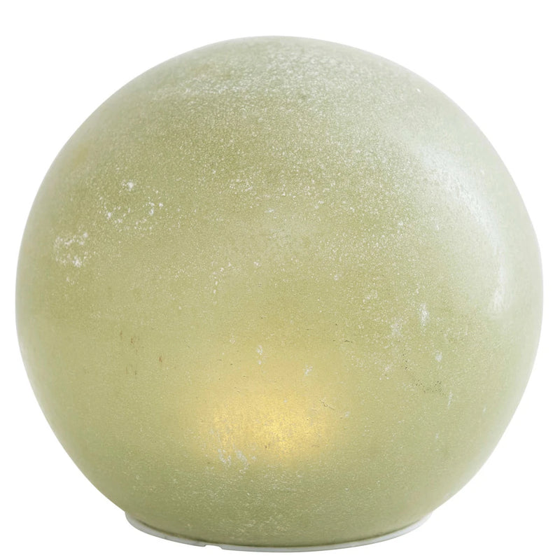 Green colored round glass globe with LED light.