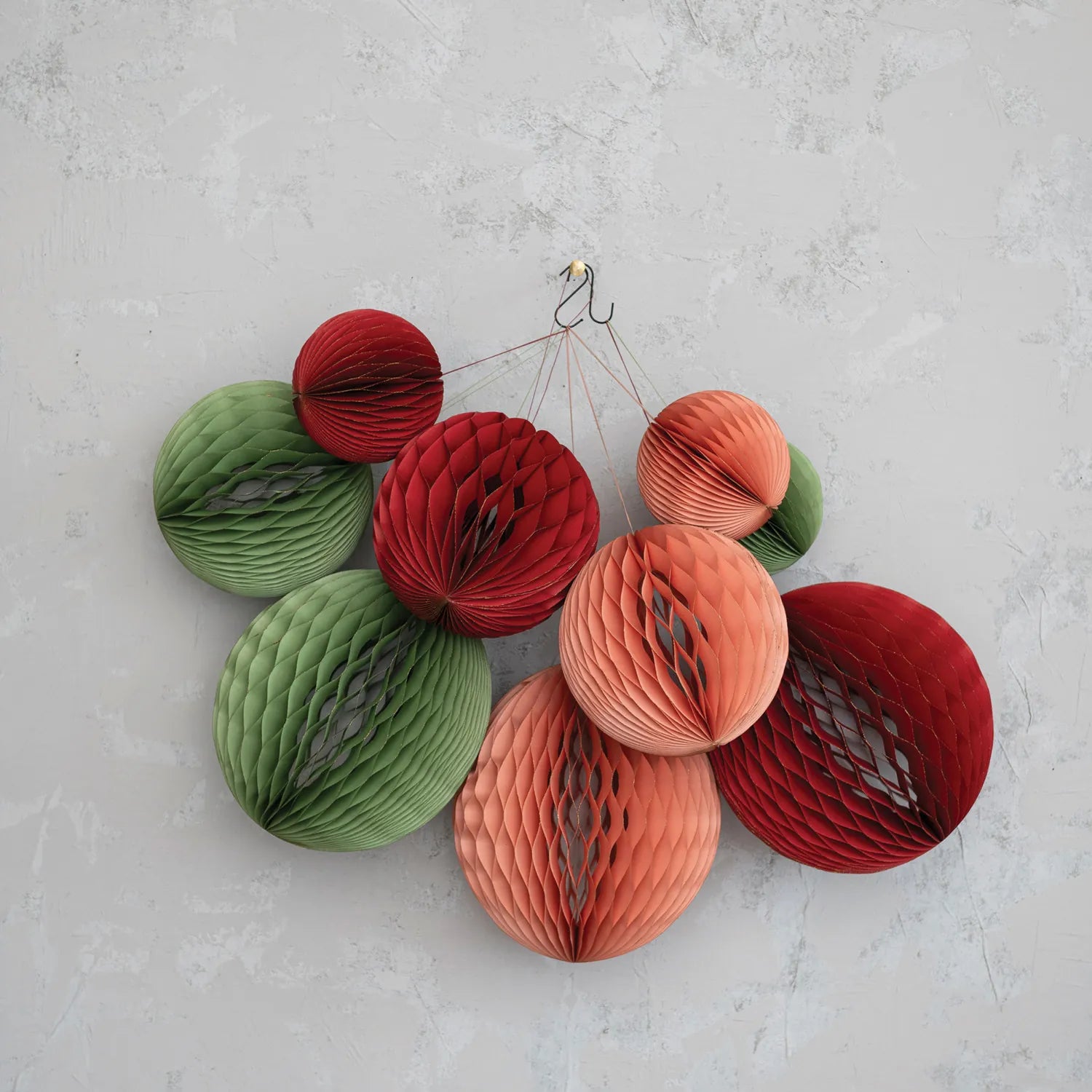 Mint green, pink and red recycled paper ball ornaments. 