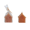 Hazelnut coloured wax candle house in wrapping. 