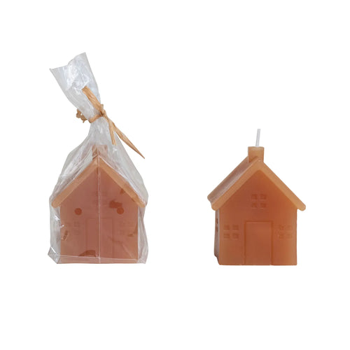 Hazelnut coloured wax candle house in wrapping. 