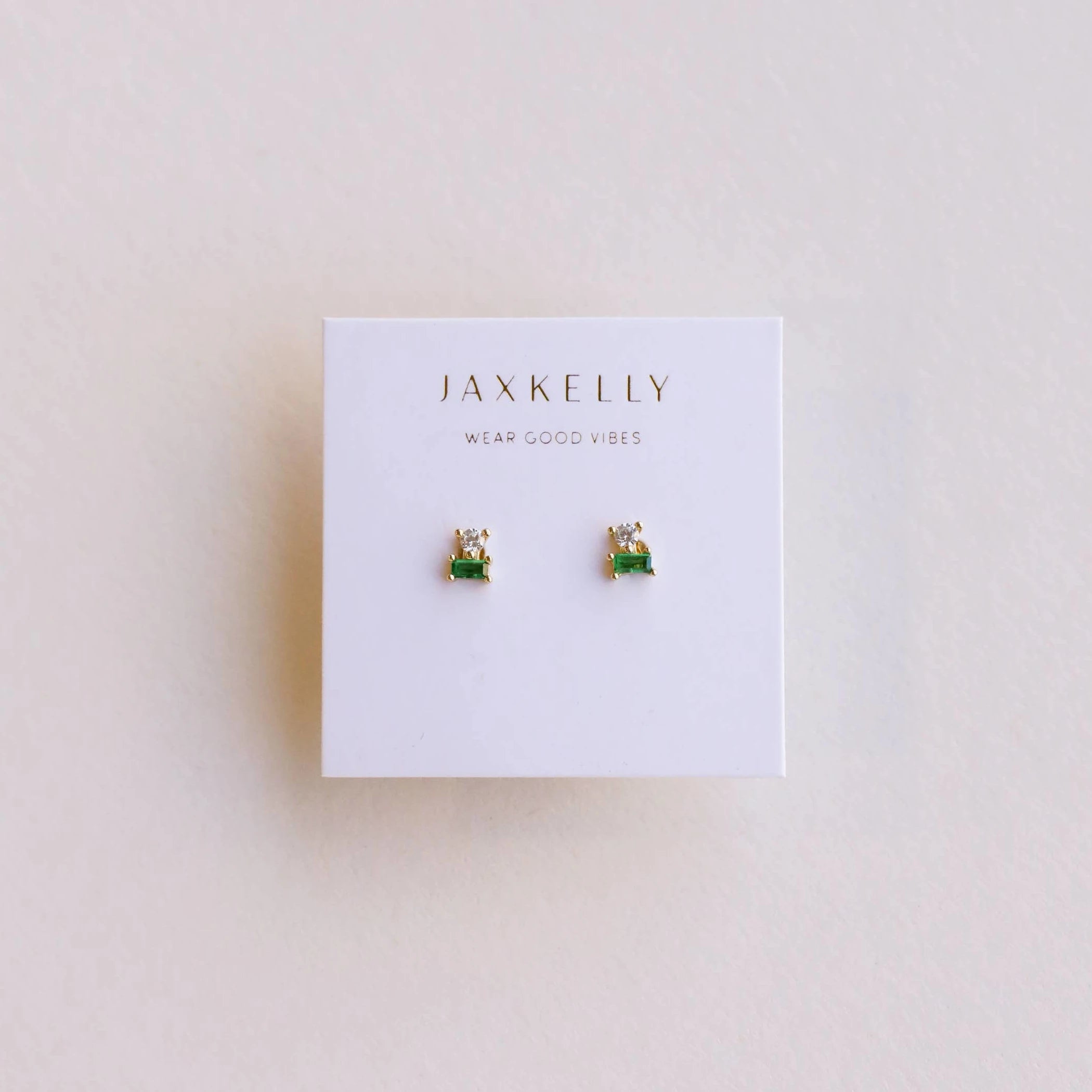JaxKelly emerald double stud stacked earrings. 