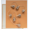Handmade jute wrapped natural beehive garland with wooden beads.