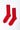 Pair of red socks on a white background